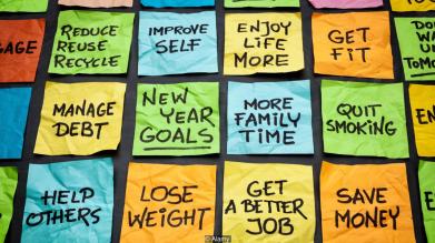 popular new year goals or resolutions - colorful sticky notes on a blackboard
